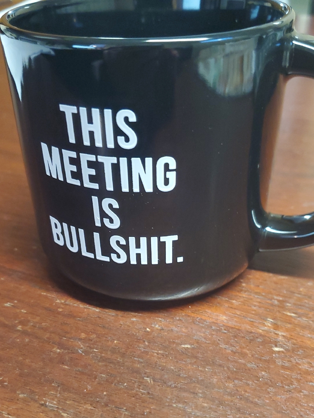 Black Ceramic Mug with White 'This Meeting Is Bullshit.' Text